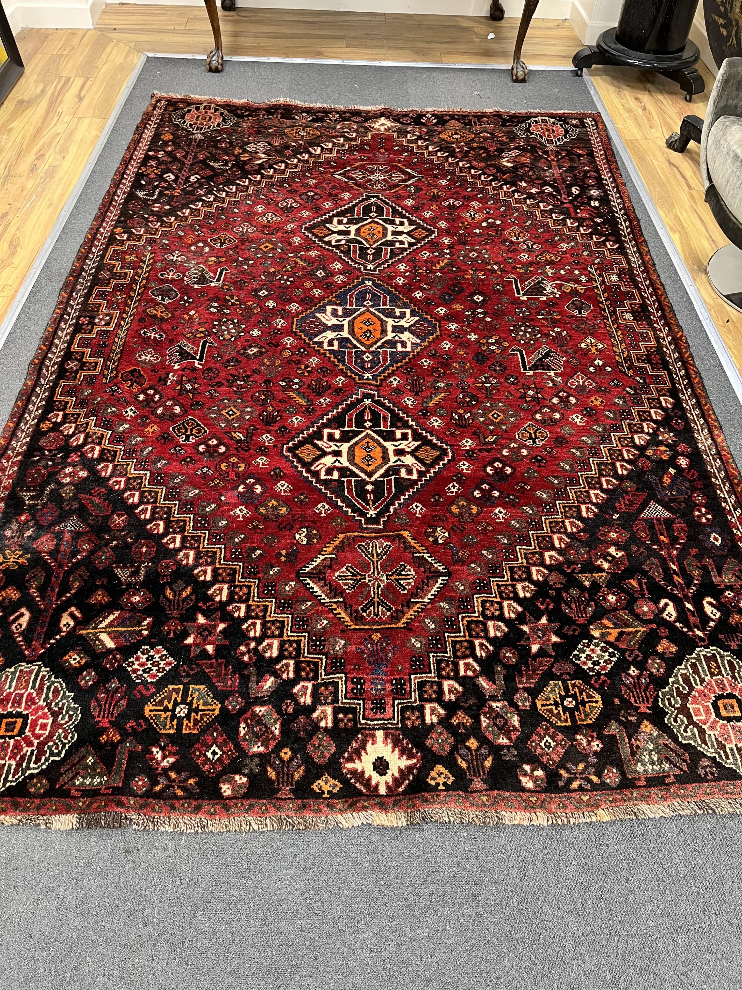 A Caucasian red ground rug, 280 x 185cm. Condition - good